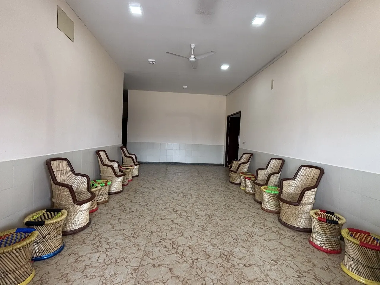 Waiting lounge with cane chairs at Guru Kripa, Agolai
